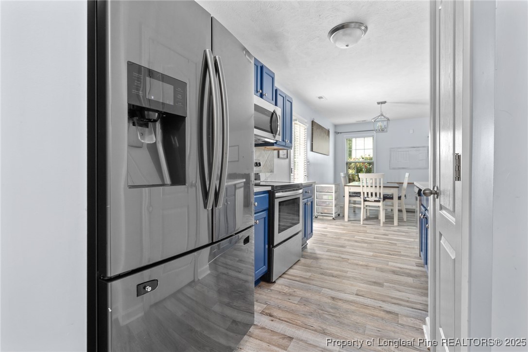 332 Dundee Circle Raeford, NC 28376 - Photo 13 of 35 a kitchen with stainless steel appliances granite countertop a refrigerator stove and oven