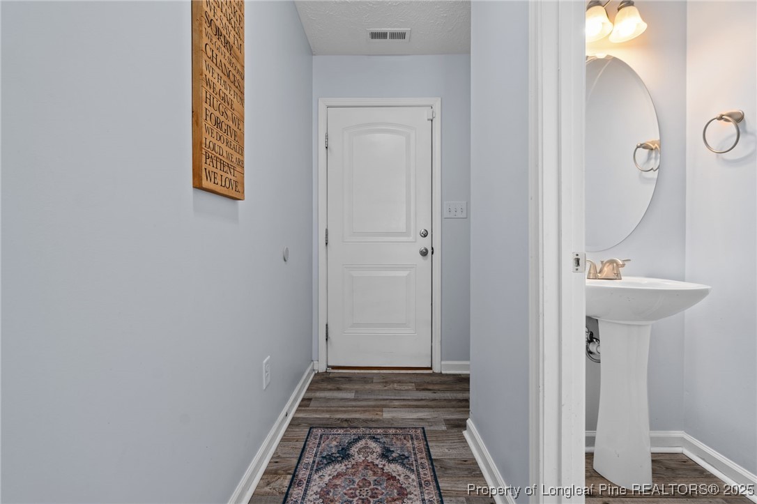 332 Dundee Circle Raeford, NC 28376 - Photo 14 of 35 a bathroom with a sink and a mirror