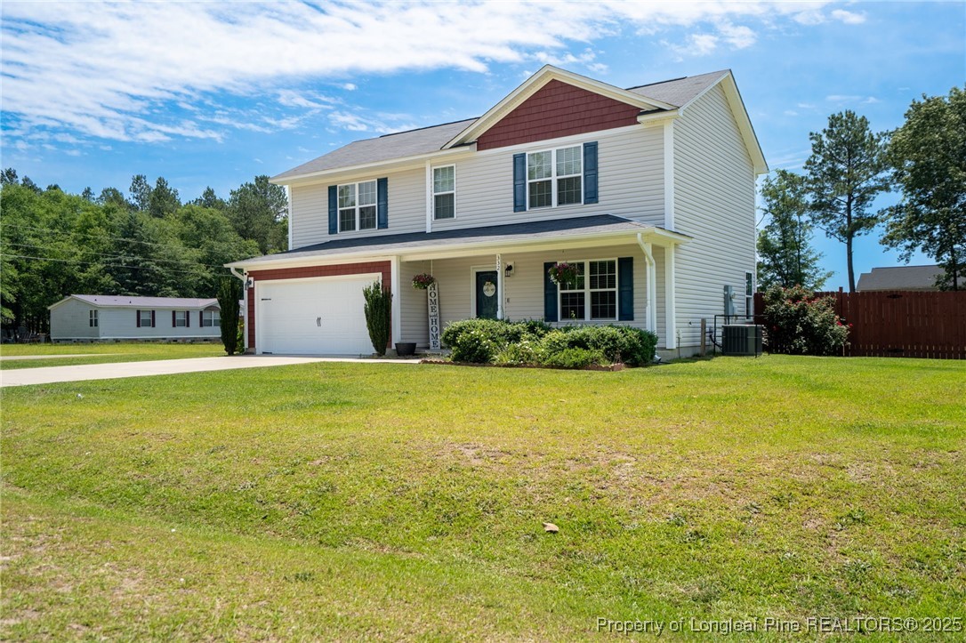 332 Dundee Circle Raeford, NC 28376 - Photo 2 of 35 a front view of a house with garden