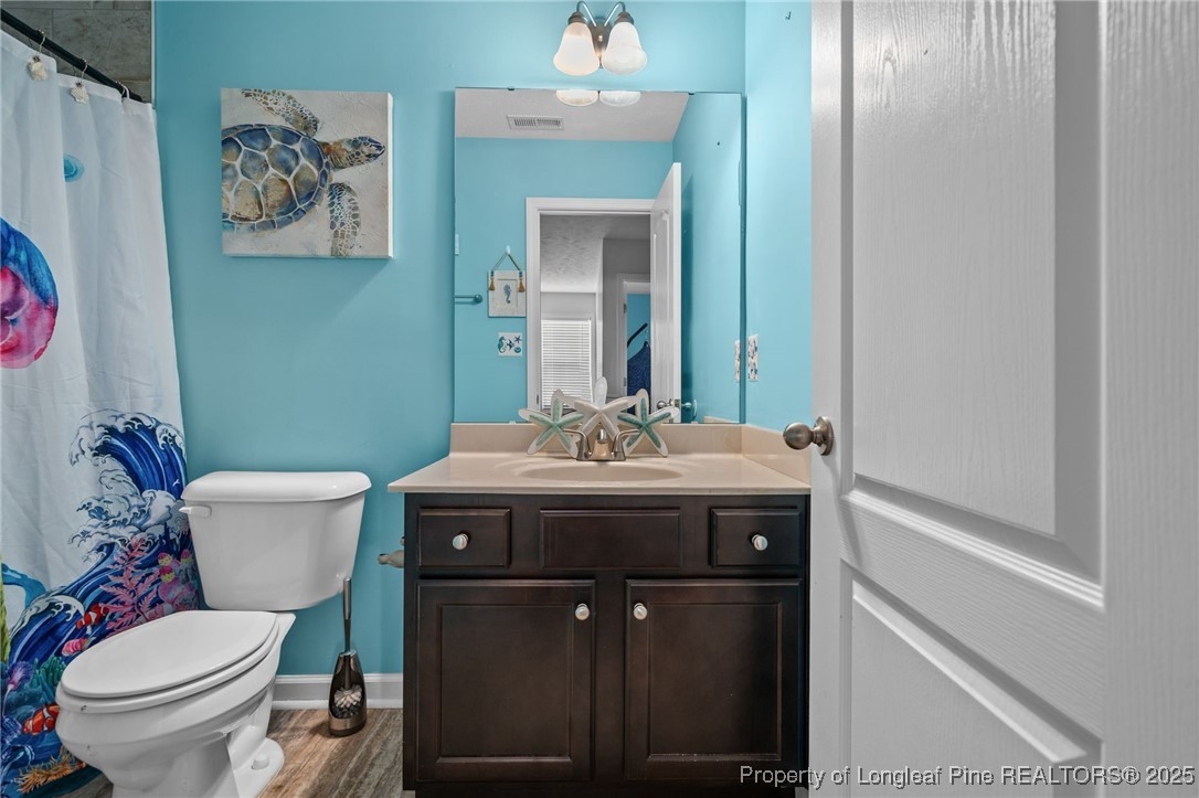 332 Dundee Circle Raeford, NC 28376 - Photo 24 of 35 a bathroom with a sink and a toilet