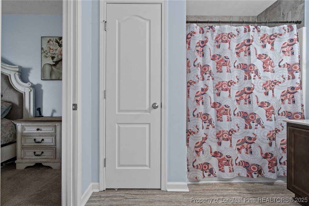 332 Dundee Circle Raeford, NC 28376 - Photo 28 of 35 a view of a bedroom with a book shelf