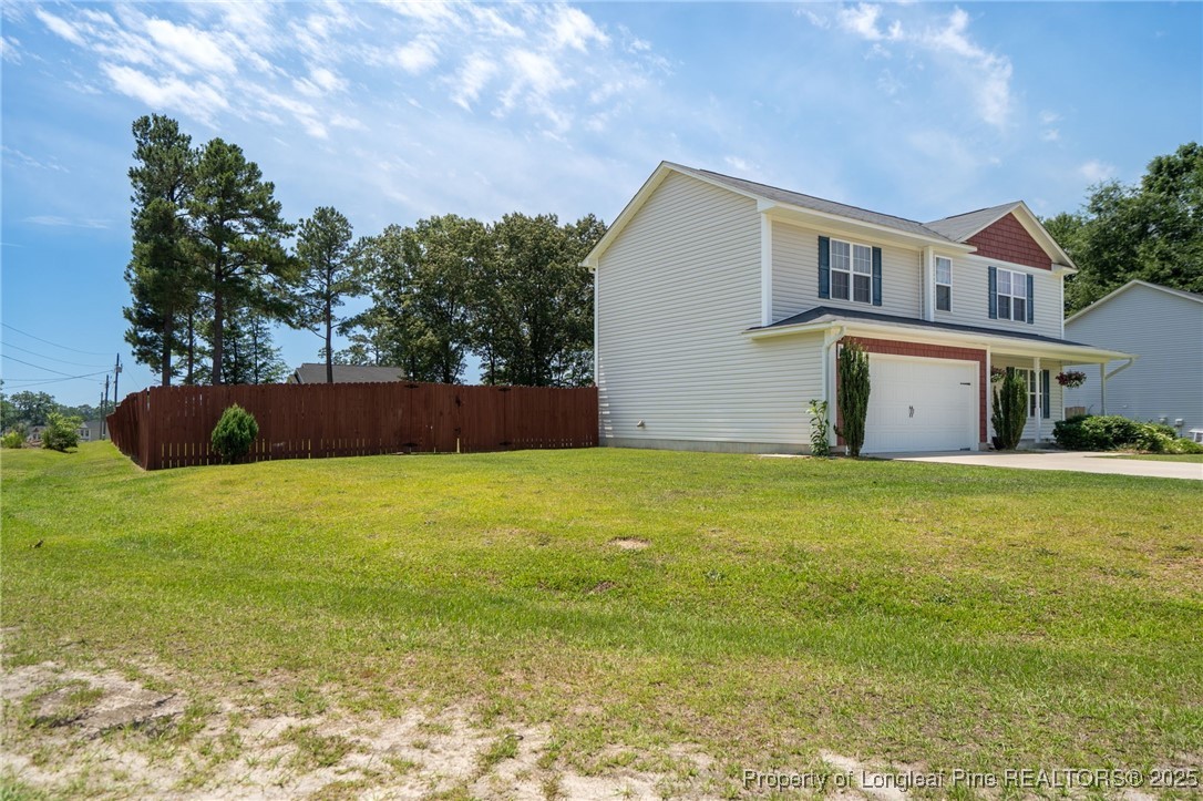332 Dundee Circle Raeford, NC 28376 - Photo 3 of 35 a view of an house with backyard and garden