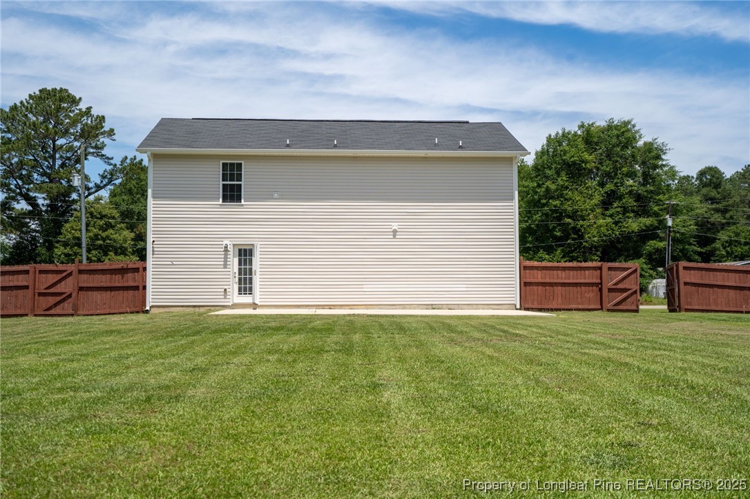 332 Dundee Circle Raeford, NC 28376 - Photo 32 of 35 a view of a backyard with plants