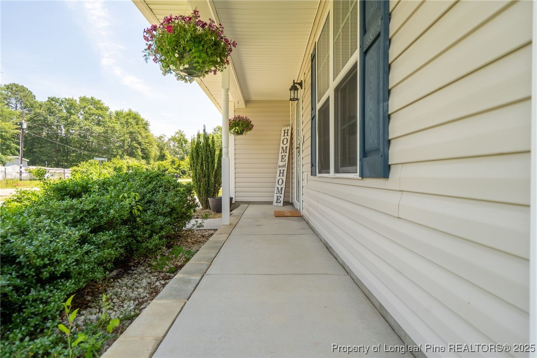 332 Dundee Circle Raeford, NC 28376 - Photo 5 of 35 a view of a pathway besides a house