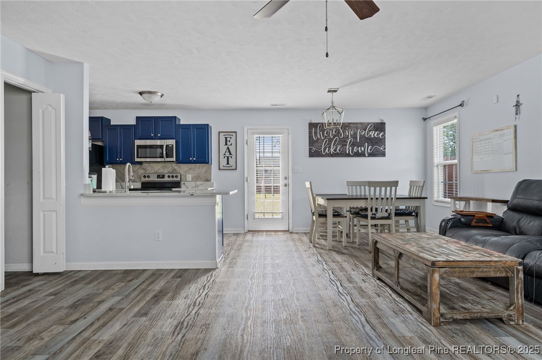 332 Dundee Circle Raeford, NC 28376 - Photo 8 of 35 a living room with furniture and a flat screen tv