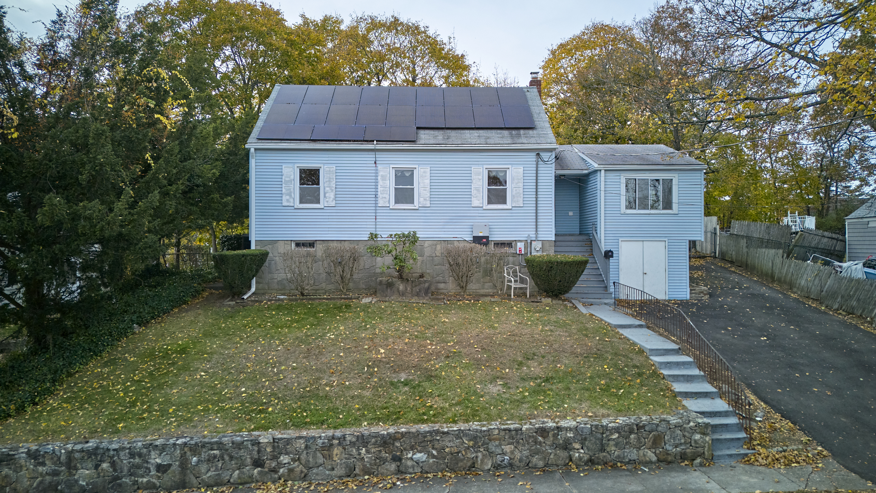 123 Beverly Drive Bridgeport, CT 06610 - Photo 1 of 34 a view of a yard in front of a house with large trees
