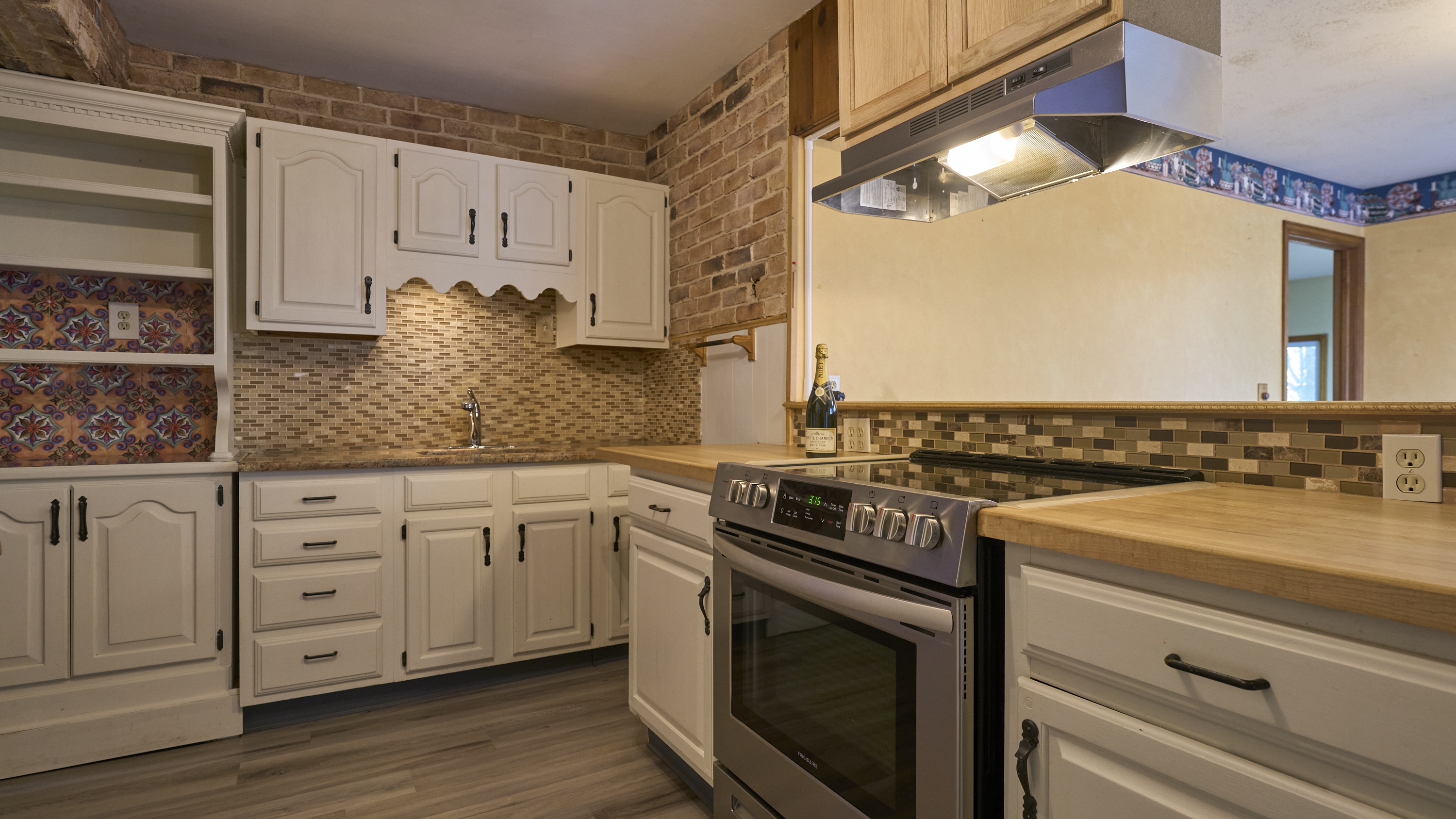 123 Beverly Drive Bridgeport, CT 06610 - Photo 14 of 34 a kitchen with granite countertop white cabinets and white appliances