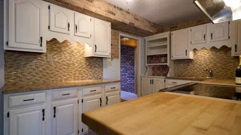 a view of a storage & utility room with wooden floor