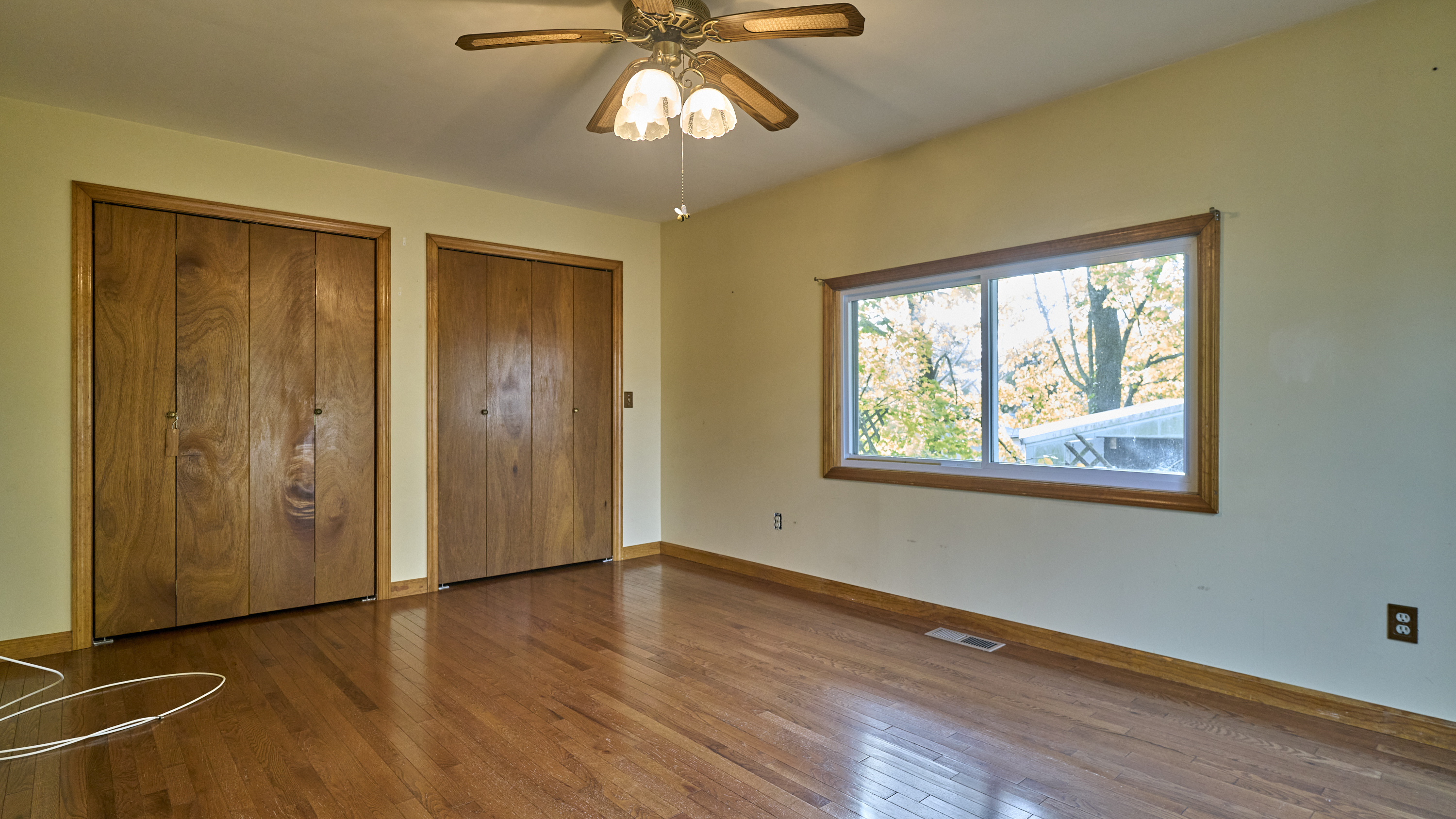 123 Beverly Drive Bridgeport, CT 06610 - Photo 19 of 34 a view of an empty room with a window and wooden floor