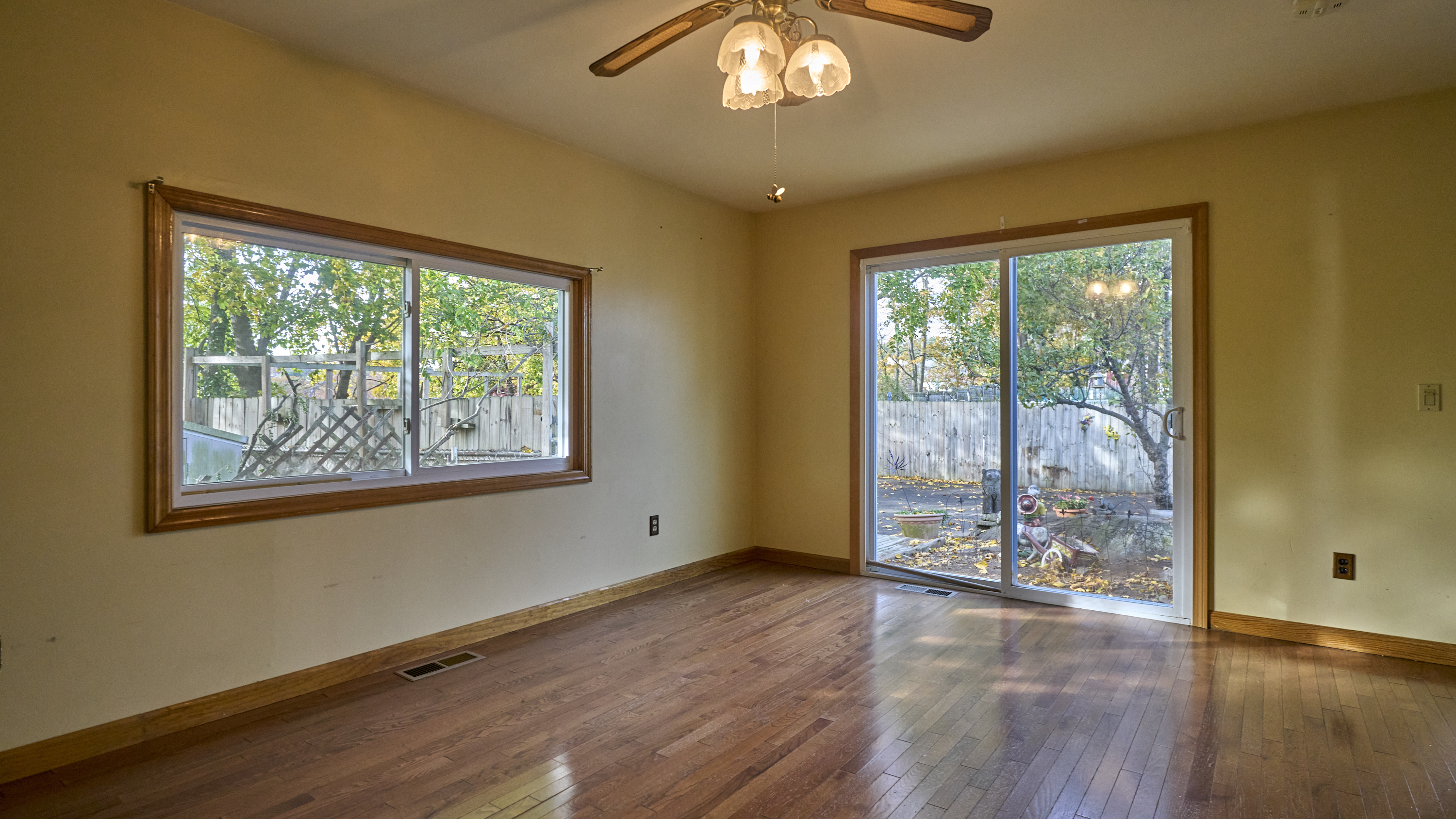 123 Beverly Drive Bridgeport, CT 06610 - Photo 20 of 34 a view of an empty room with wooden floor and a window