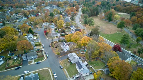 an aerial view of residential houses with outdoor space