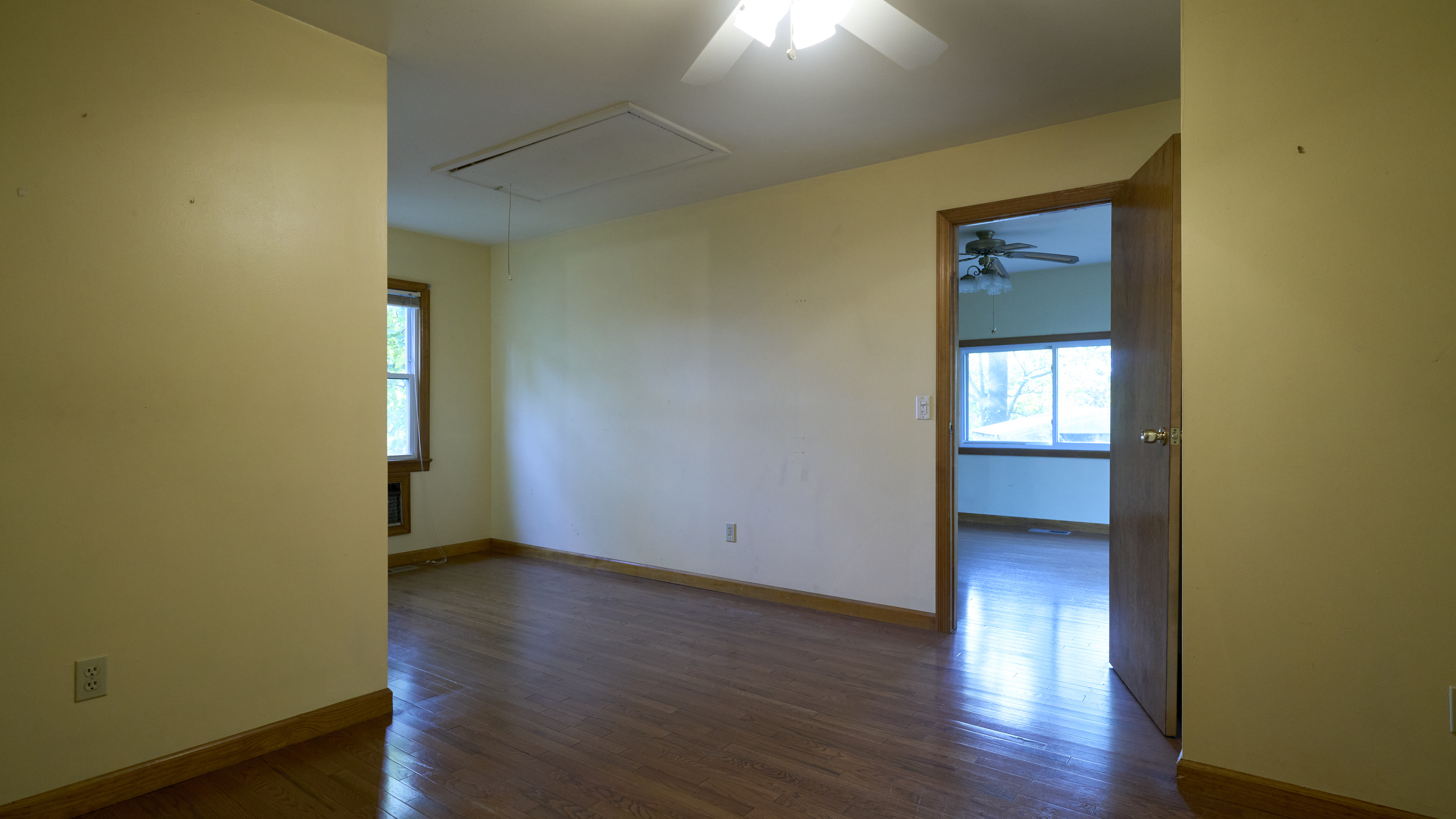 123 Beverly Drive Bridgeport, CT 06610 - Photo 22 of 34 a view of an empty room with wooden floor and a window