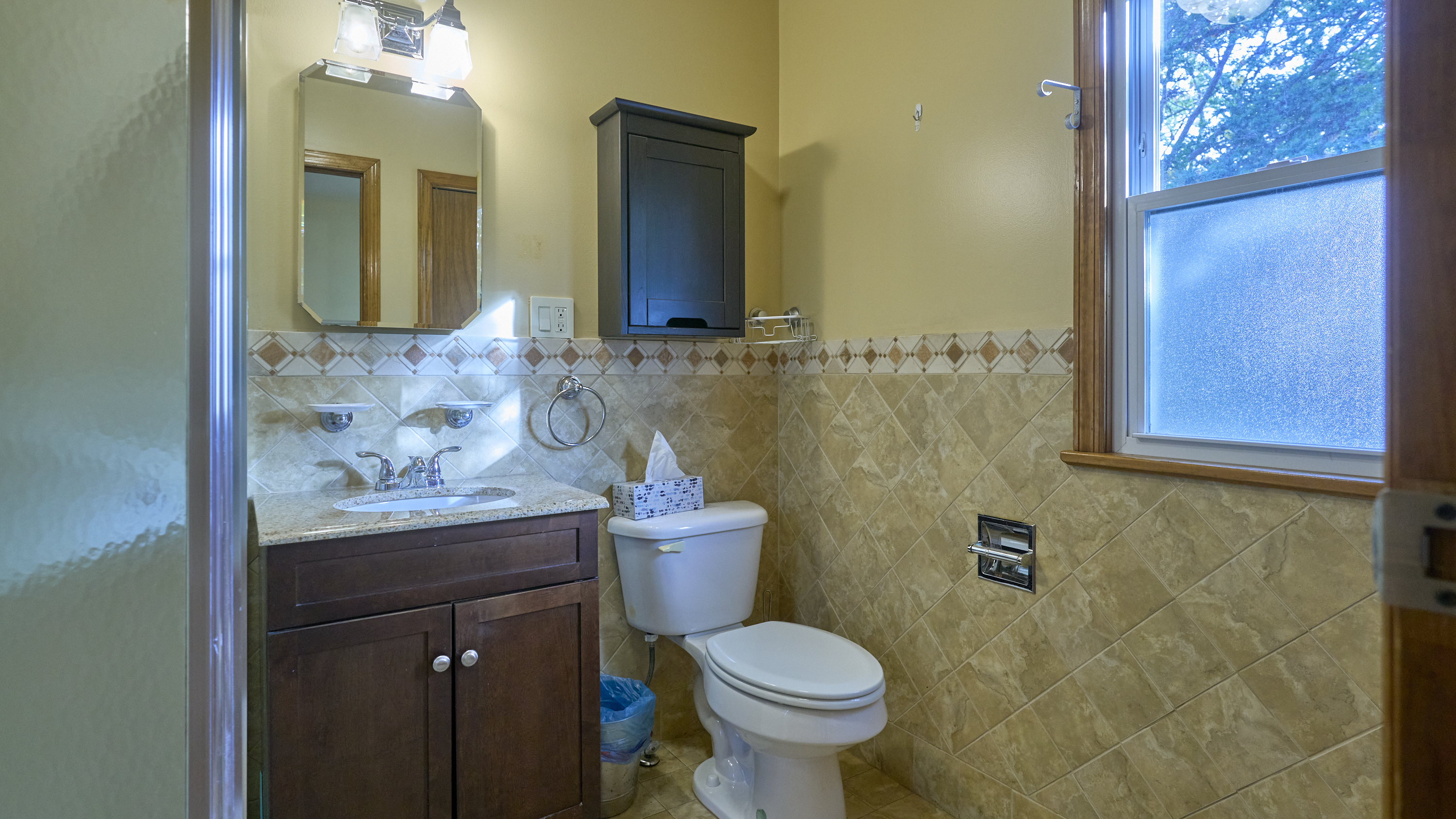 123 Beverly Drive Bridgeport, CT 06610 - Photo 23 of 34 a bathroom with a granite countertop toilet sink and mirror