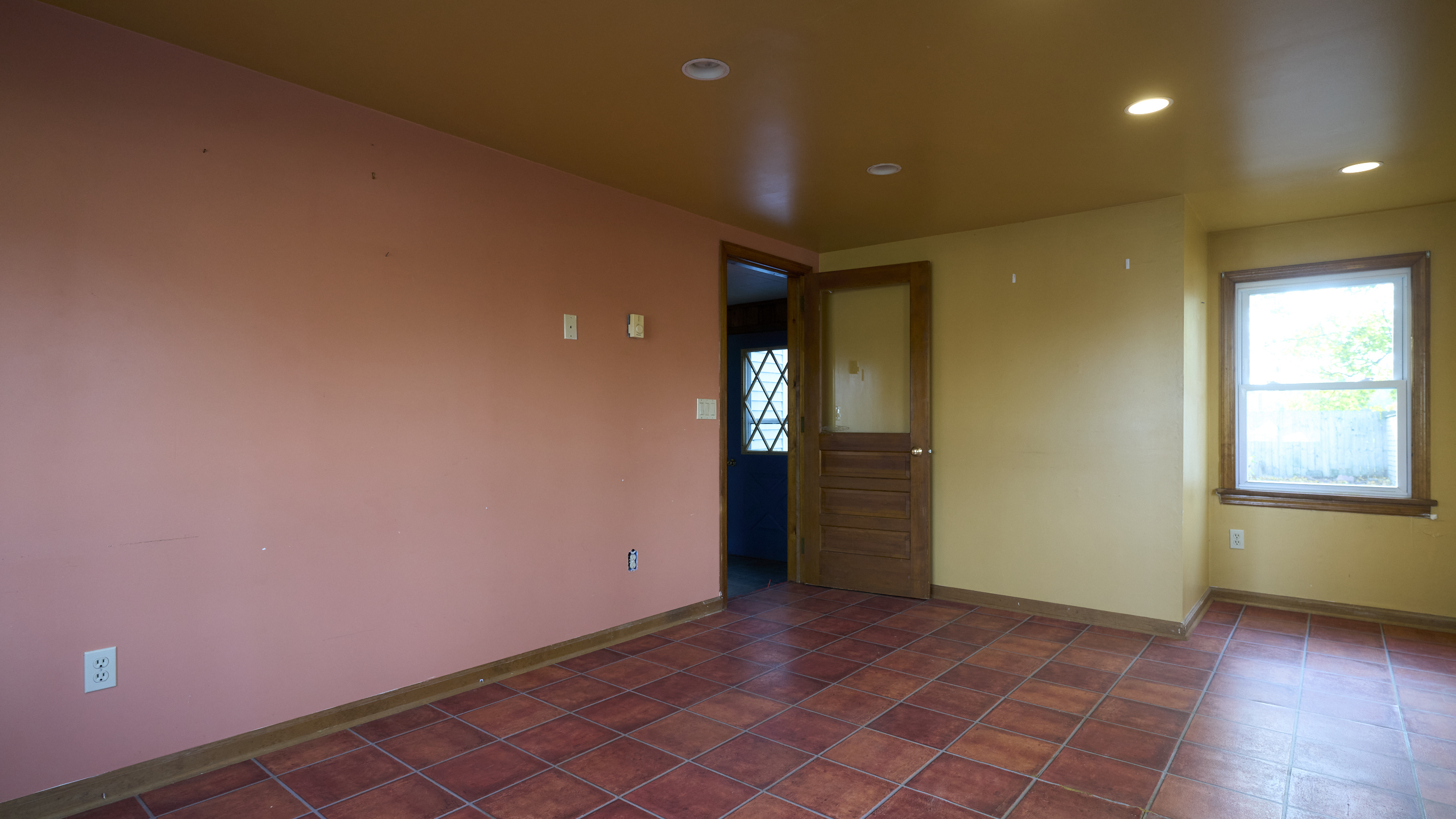 123 Beverly Drive Bridgeport, CT 06610 - Photo 33 of 34 an empty room with wooden floor and windows