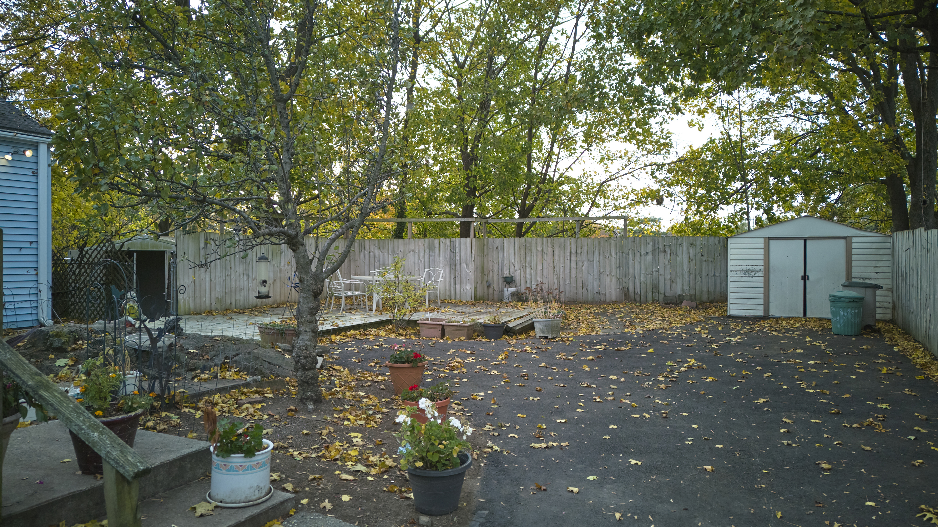 123 Beverly Drive Bridgeport, CT 06610 - Photo 4 of 34 a backyard of a house with table and chairs