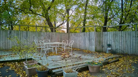 a view of an outdoor space with table and chairs