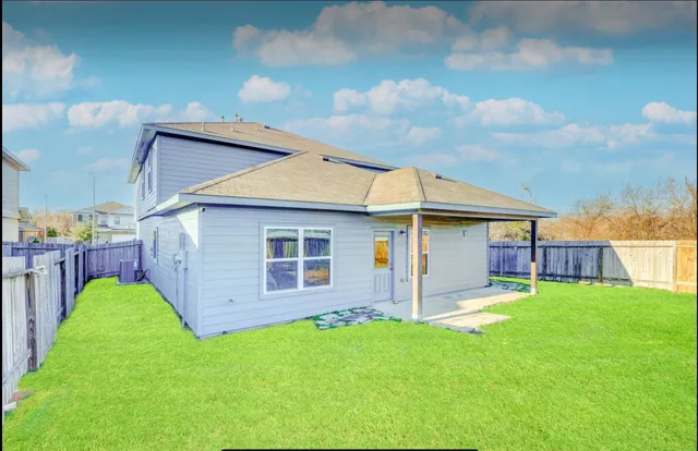 a view of a backyard with a garden and plants