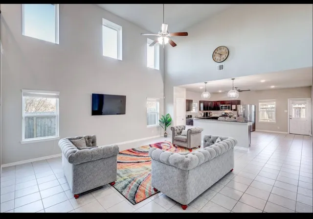 a living room with furniture and a window