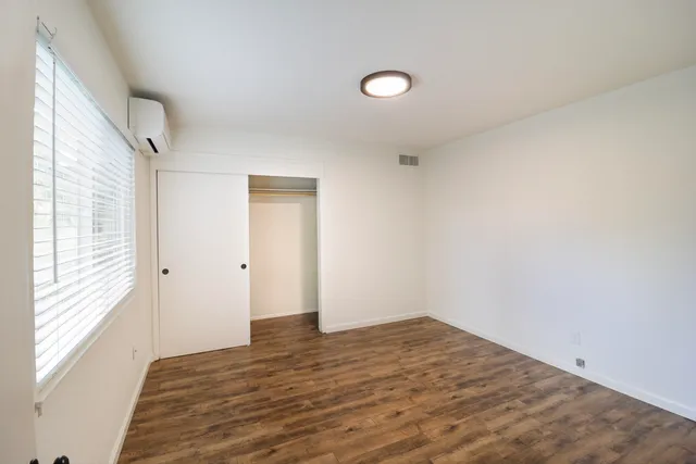 a front view of house with yard and trees