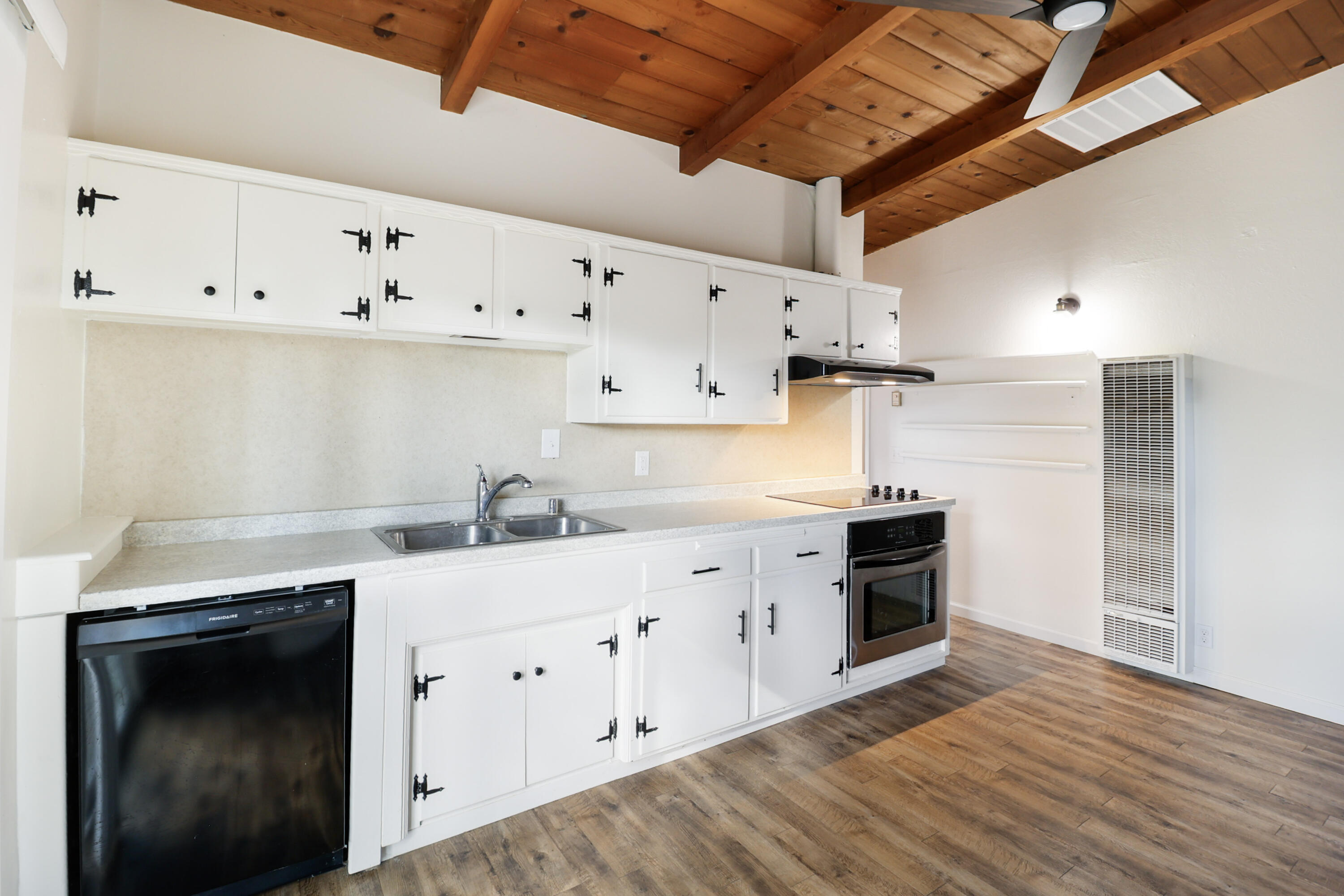 2358 Balls Ferry Road Anderson, CA 96007 - Photo 7 of 24 a kitchen with granite countertop a stove cabinets and a wooden floor