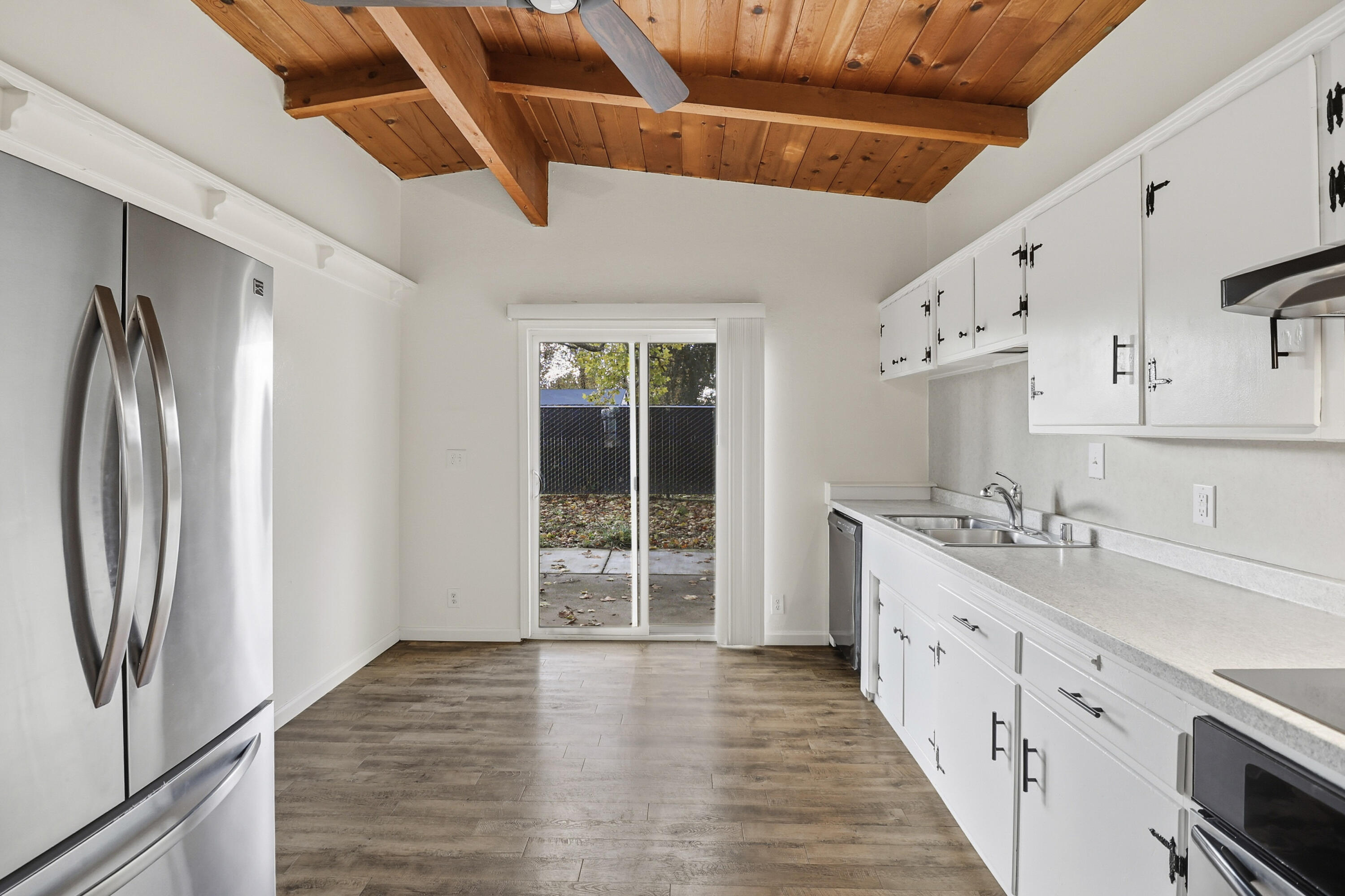 2358 Balls Ferry Road Anderson, CA 96007 - Photo 9 of 24 a kitchen with cabinets and wooden floor