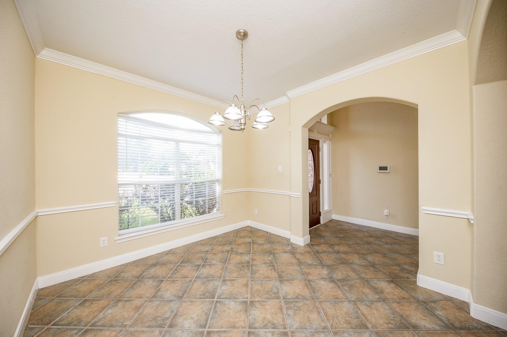 4409 Juan Carlos Court Rosenberg, TX 77471 - Photo 4 of 32 a view of a livingroom with a chandelier fan and windows