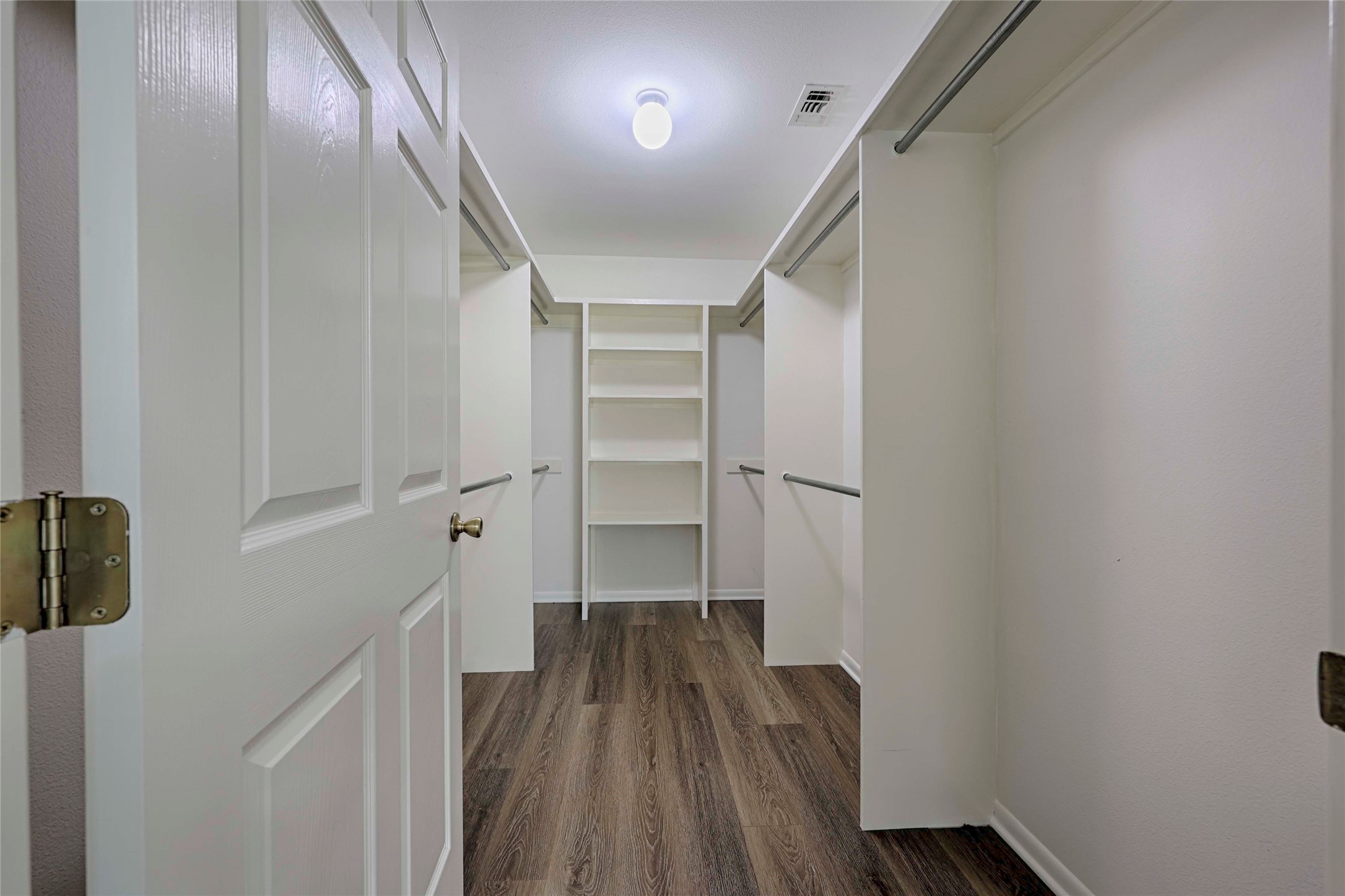 3545 East I- 10 Frontage Road Schulenburg, TX 78956 - Photo 19 of 40 a view of walk in closet with wooden floor
