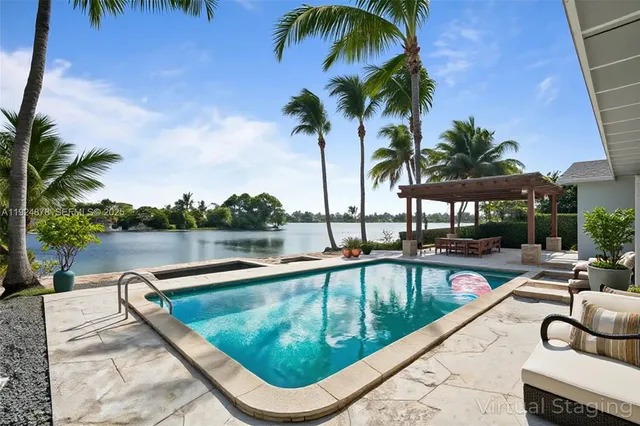 a view of swimming pool with chairs