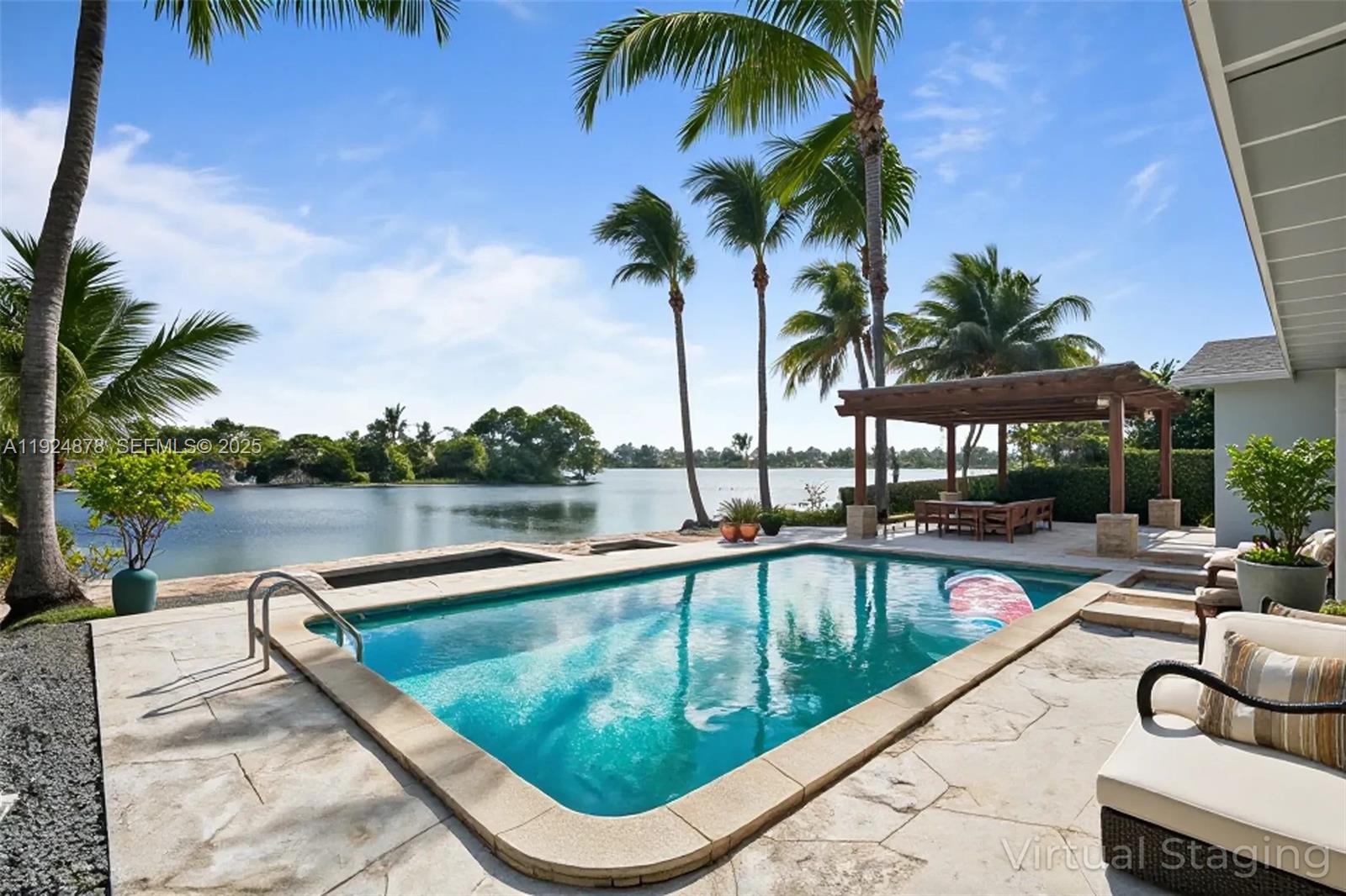 19911 Southwest 82nd Place Cutler Bay, FL 33189 - Photo 1 of 43 a view of swimming pool with chairs