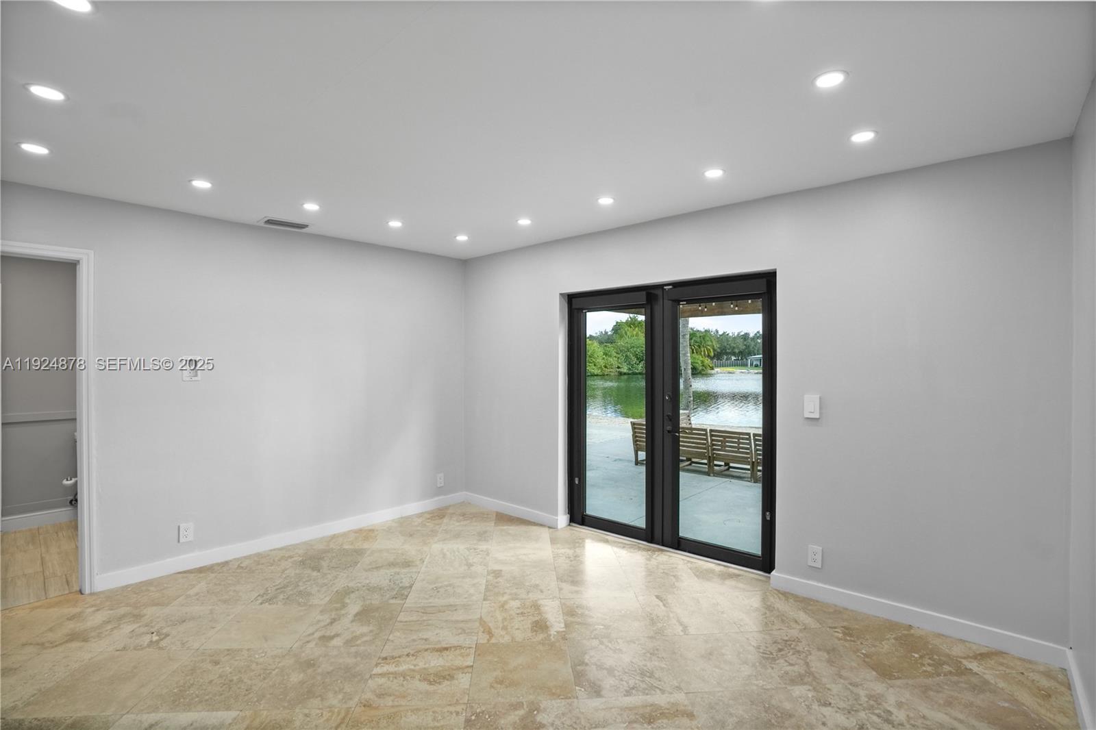 19911 Southwest 82nd Place Cutler Bay, FL 33189 - Photo 15 of 43 a view of an empty room with a window