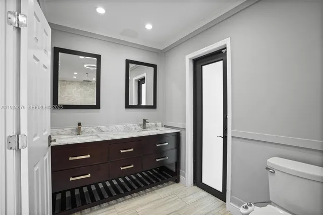 a bathroom with a toilet and shower