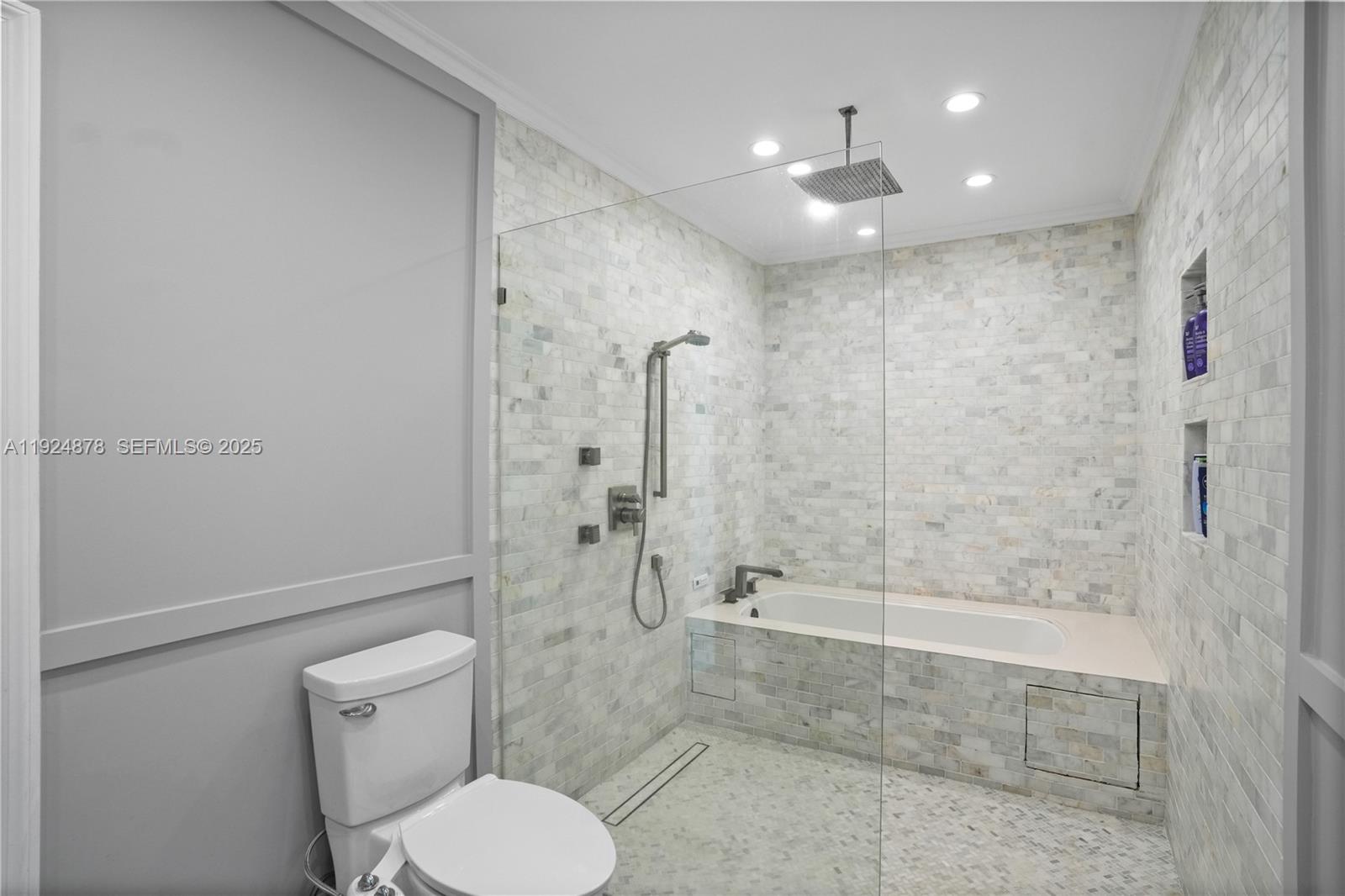 19911 Southwest 82nd Place Cutler Bay, FL 33189 - Photo 19 of 43 a bathroom with a toilet and shower