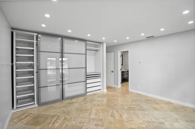 a bathroom with a sink toilet and a mirror