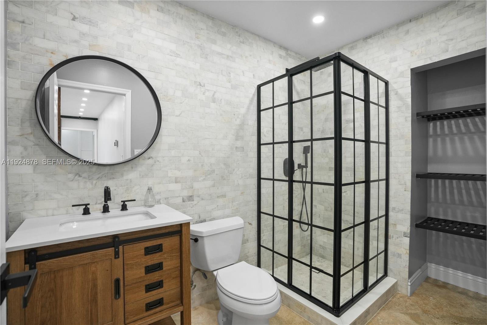 19911 Southwest 82nd Place Cutler Bay, FL 33189 - Photo 23 of 43 a bathroom with a sink toilet and a mirror