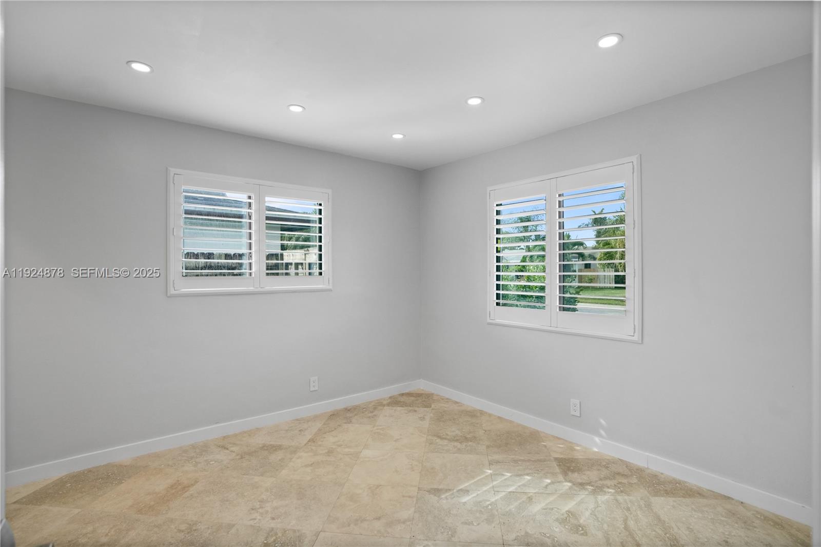 19911 Southwest 82nd Place Cutler Bay, FL 33189 - Photo 25 of 43 an empty room with a window