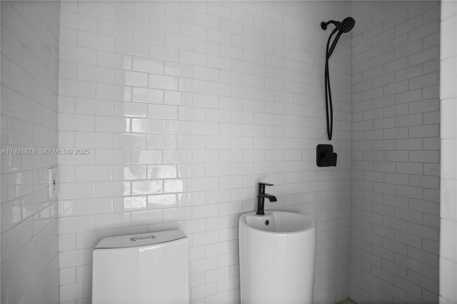 19911 Southwest 82nd Place Cutler Bay, FL 33189 - Photo 27 of 43 a bathroom with a sink toilet and shower