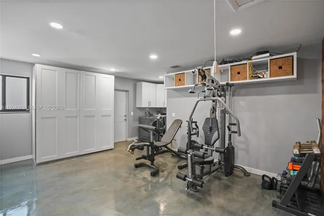 a view of a patio with a table and chairs