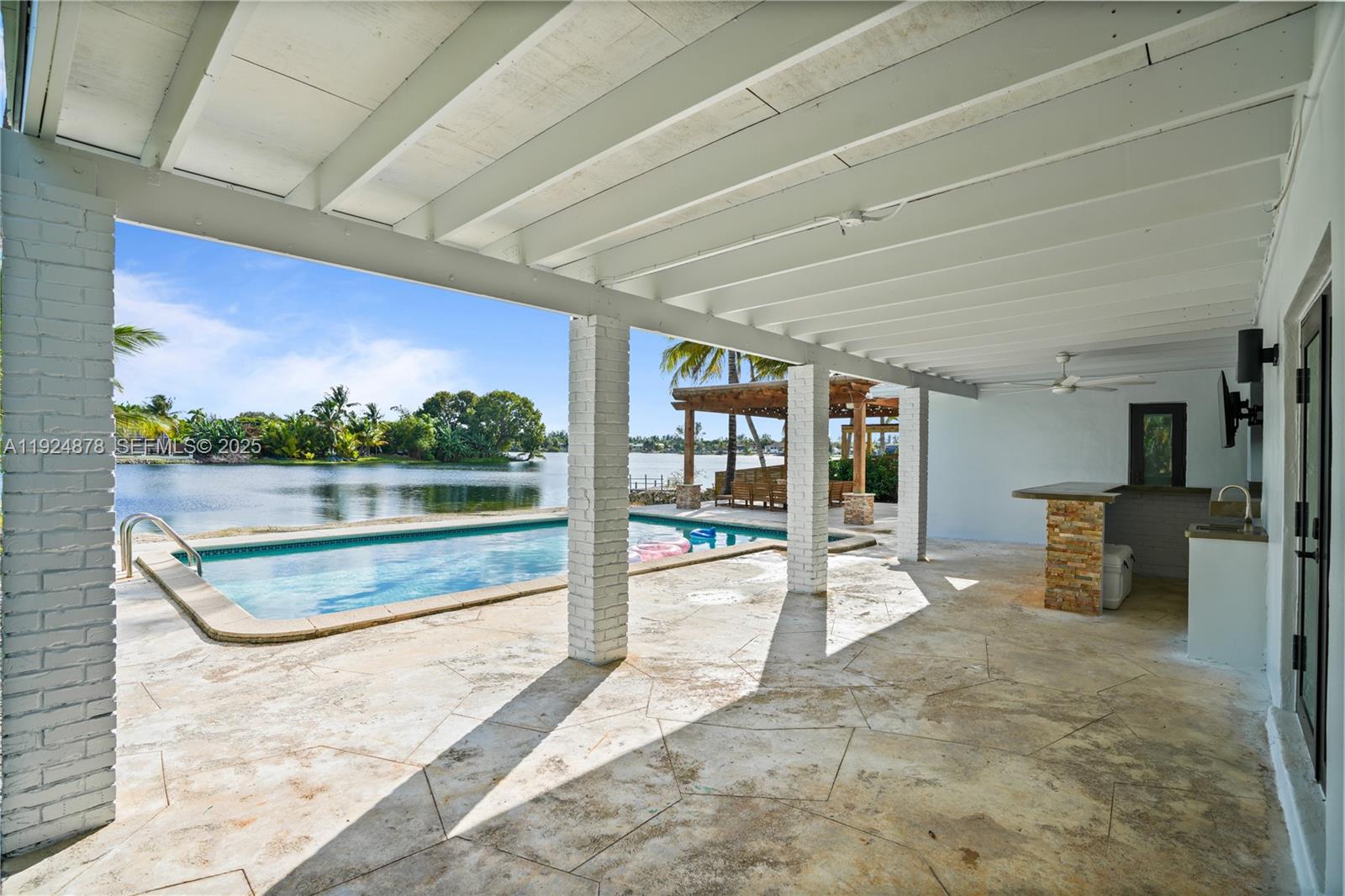 19911 Southwest 82nd Place Cutler Bay, FL 33189 - Photo 32 of 43 a view of a patio with a table and chairs