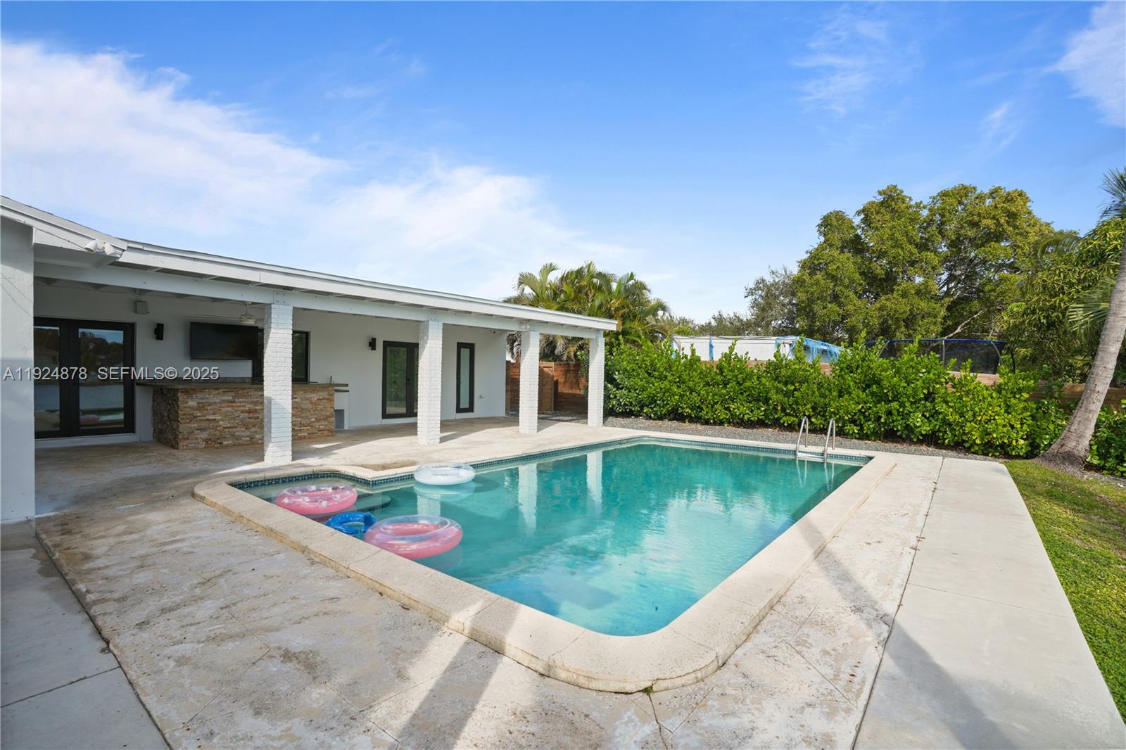 19911 Southwest 82nd Place Cutler Bay, FL 33189 - Photo 36 of 43 a view of a house with swimming pool and sitting area