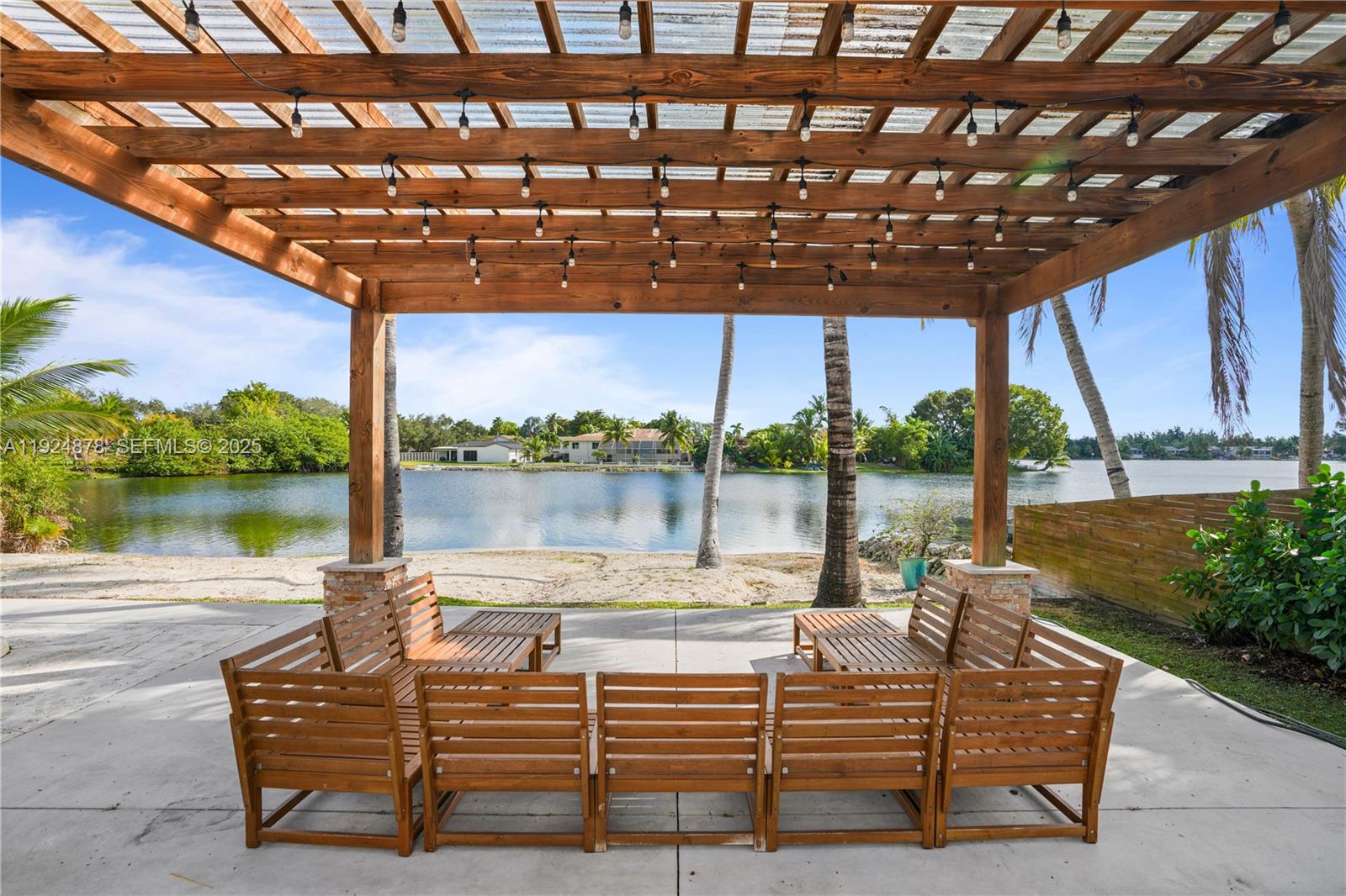 19911 Southwest 82nd Place Cutler Bay, FL 33189 - Photo 39 of 43 a view of a swimming pool with a couches in a patio