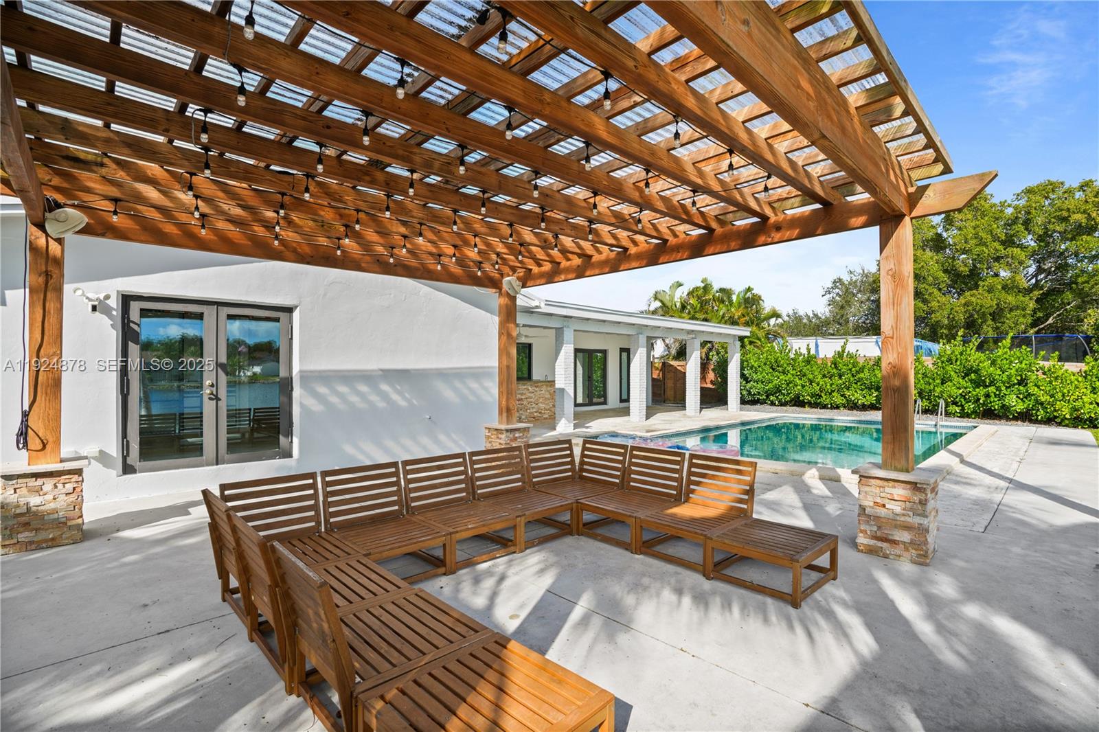 19911 Southwest 82nd Place Cutler Bay, FL 33189 - Photo 40 of 43 a view of patio with a table and chairs