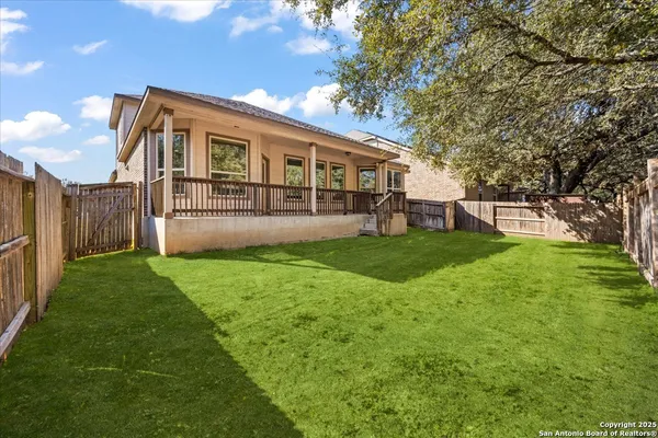 a view of a house with a yard and sitting area