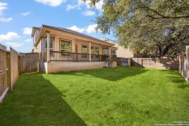 a view of a house with a yard and sitting area