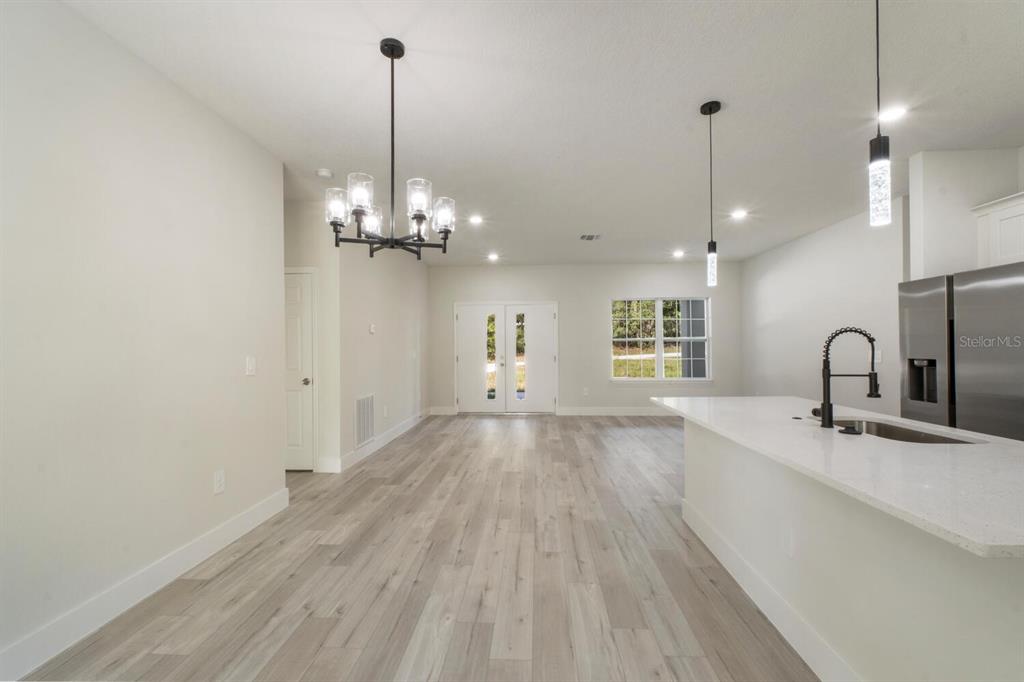 9371 North Cougar Paw Drive Dunnellon, FL 34433 - Photo 11 of 34 a spacious bathroom with a granite countertop sink a mirror and with shower