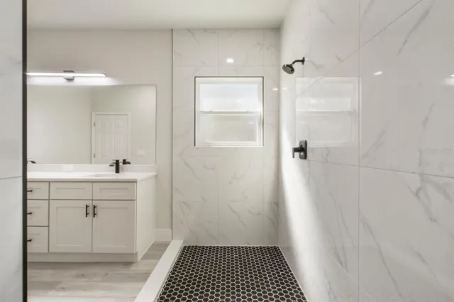 a bathroom with a sink and a mirror