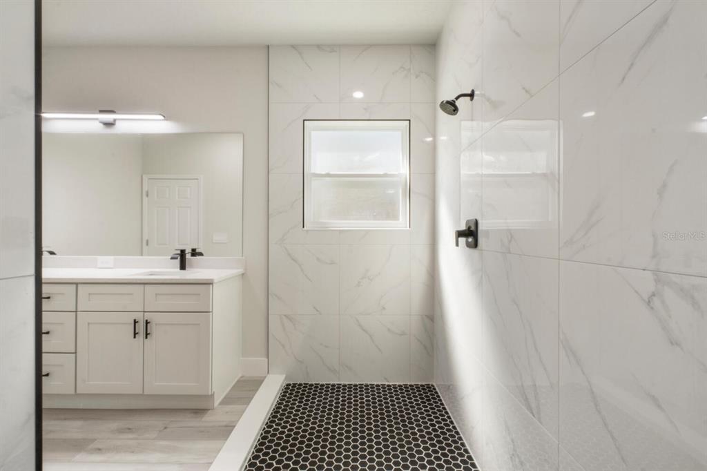 9371 North Cougar Paw Drive Dunnellon, FL 34433 - Photo 23 of 34 a bathroom with a sink and a mirror