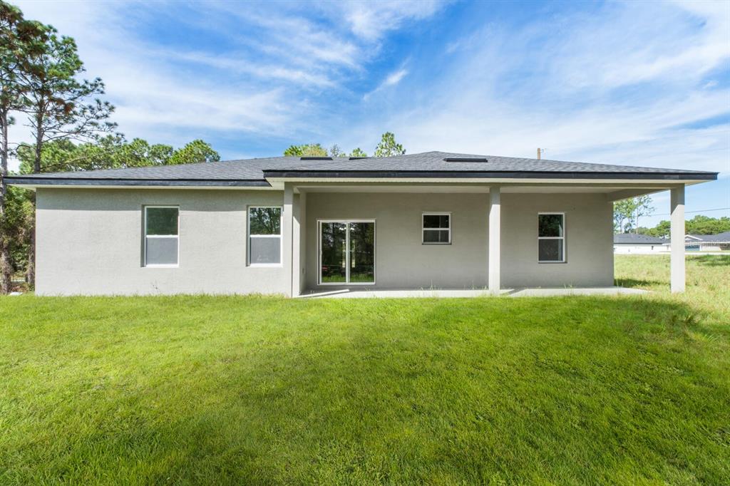 9371 North Cougar Paw Drive Dunnellon, FL 34433 - Photo 32 of 34 front view of house with a yard