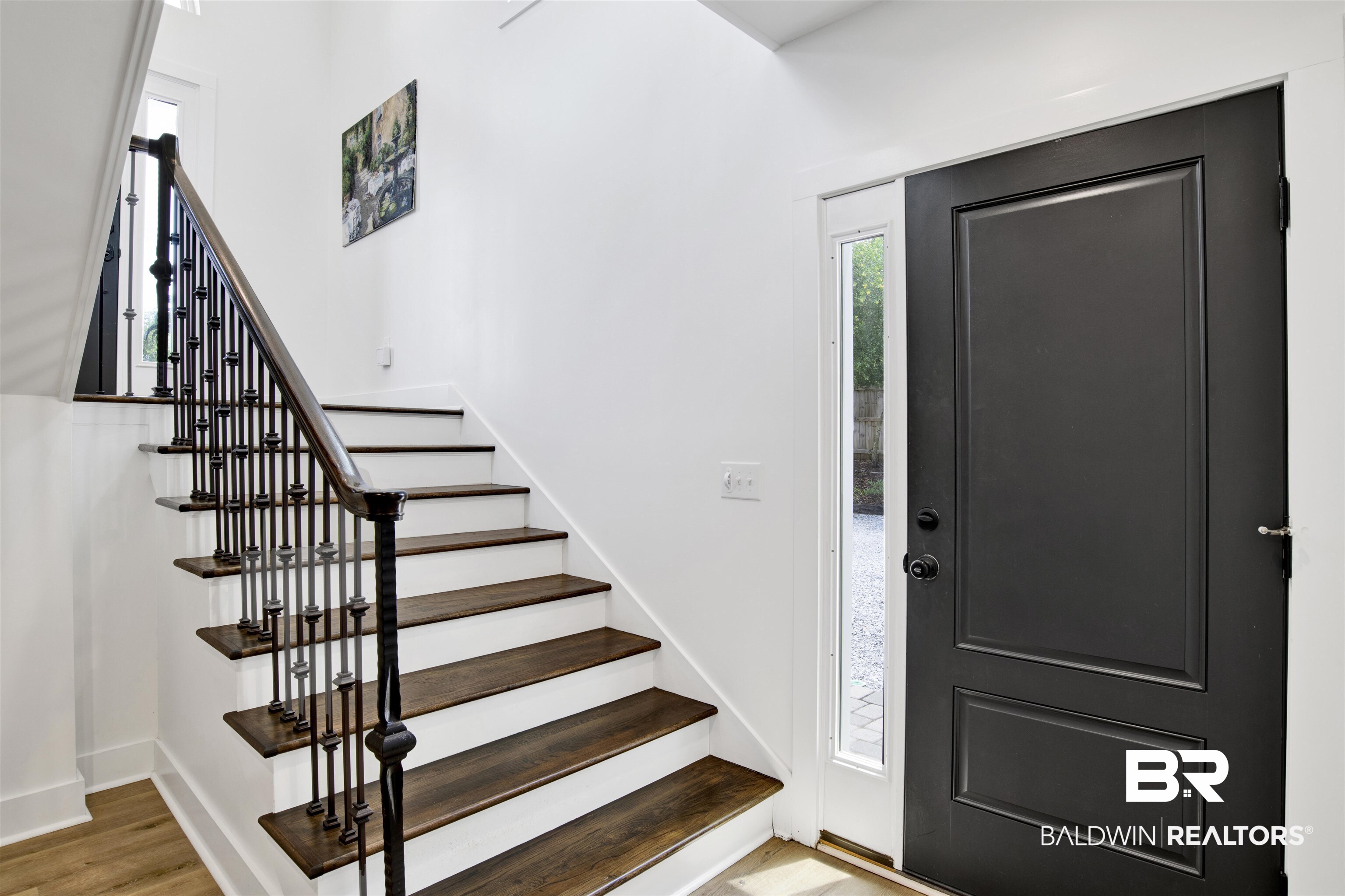 30538 River Road Orange Beach, AL 36561 - Photo 41 of 78 Entryway with stairs and wood finished floors