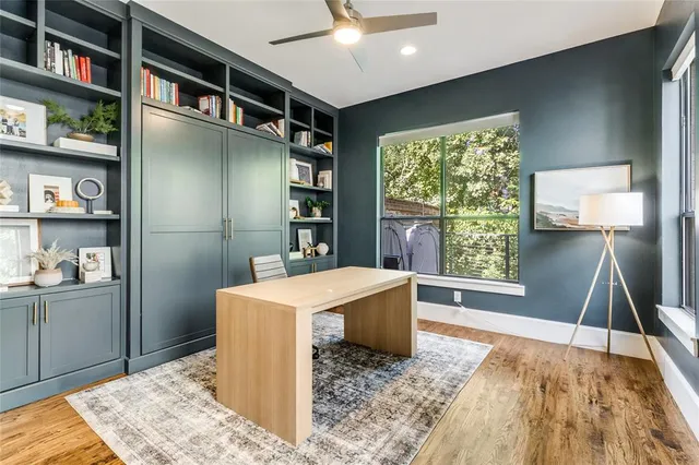 a room with cabinets and wooden floor