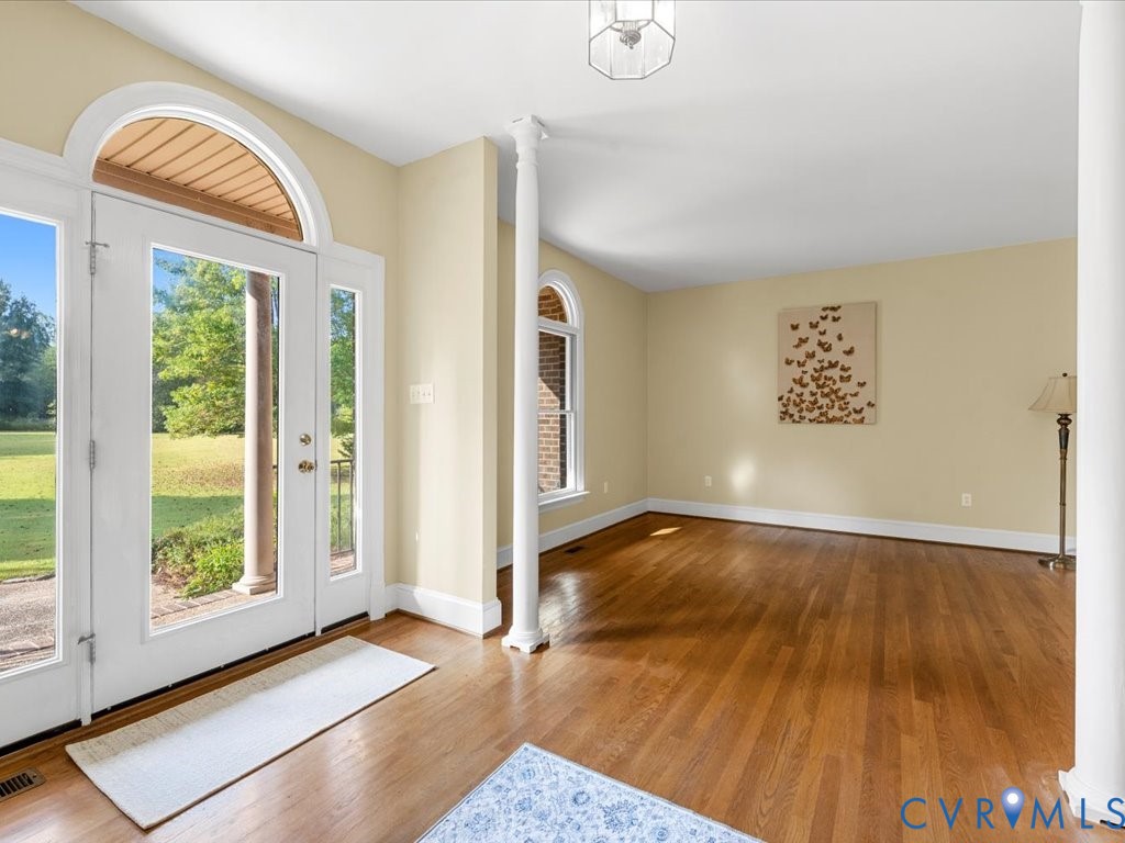 5515 Herring Creek Road Aylett, VA 23009 - Photo 12 of 50 a view of an empty room with a window and wooden floor